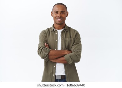 Business, People And Lifestyle Concept. Portrait Of Handsome African American Man Cross Hands On Chest And Smiling Pleased, Own Small Shop, Manage Store With Help Of Employees, White Background