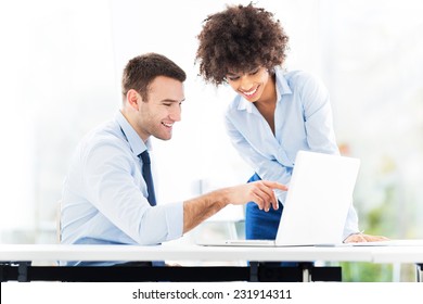 Business People Looking At Laptop 