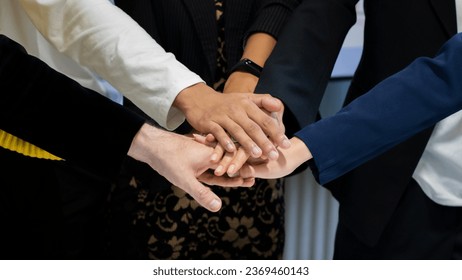 business people making pile of handstogether during their meeting