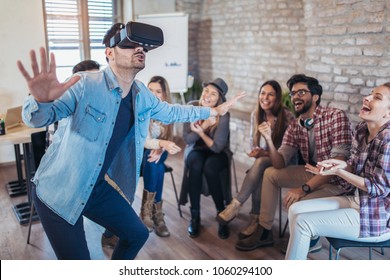 Business People Making Team Training Exercise During Team Building Seminar Using VR Glasses