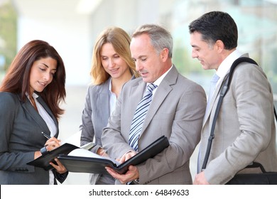 Business People Meeting At An Exhibition