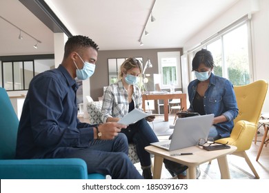 Business People Meeting With Face Masks In The Office