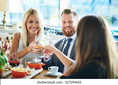 business people meeting in modern restaurant. having dinner, drinking wine.