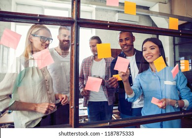 Business People Meeting At Office And Use Post It Notes To Share Idea. Brainstorming Concept. Sticky Note On Glass Wall.