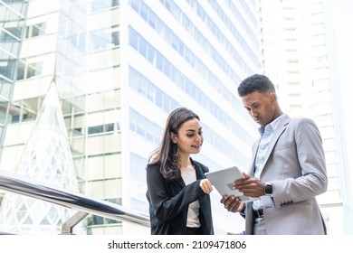 Business People Meeting Talking And Sharing Their Ideas In City. Business Team And Teamwork Concept. Business People Standing Outside In The City Discussing About New Project.