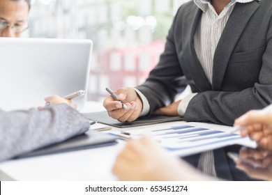 Business People Meeting working in office for discussing documents and ideas , with soft focus, vintage tone - Shutterstock ID 653451274