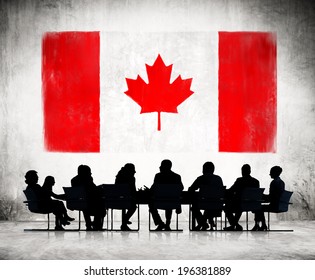 Business People And The National Flag Of Canada