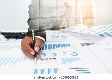 Business people Negotiating a contract, they are pointing on a Document and Discussing together.Businessmen are Negotiating deal Agreement collaboration talk in office concept. - Shutterstock ID 1049500865