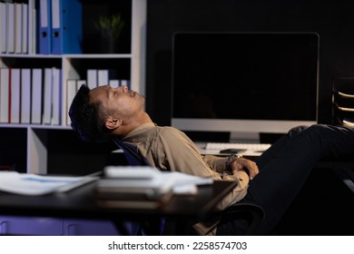 Business people in the night office who work overtime are sleepy and tired from overwork. - Shutterstock ID 2258574703