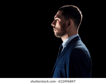 Business, People And Office Concept - Buisnessman In Suit Over Black Background