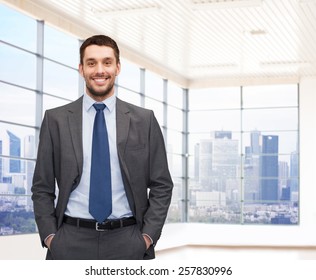 Business, People And Office Concept - Happy Young Businessman Over Office Room Or New Apartment Background