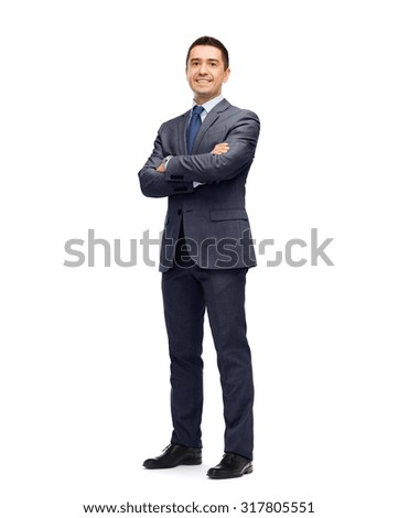 business, people and office concept - happy smiling businessman in dark grey suit