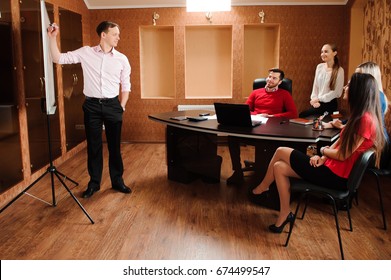 Business people in office holding a conference and discussing strategies - Shutterstock ID 674499547