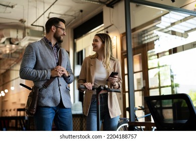 Business people in office talking. Beautiful businesswoman talking with colleagues.	 - Powered by Shutterstock