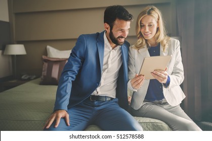 Business people on business trip staying in hotel - Powered by Shutterstock