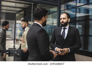 Business People Outdoor Meeting. Male Employees In Suits Communicate Outdoors. Business Partners Discuss And Argue. Relationships And Promotion. Teamwork And Friendship