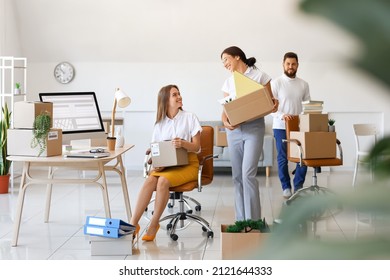 Business People Packing Things In Office On Moving Day