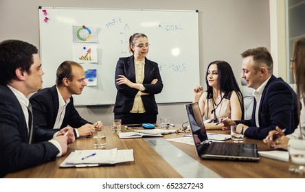 Business people partners discussing in meeting (conference) documents and ideas in a modern office - Shutterstock ID 652327243