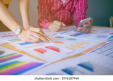 Business people are planning and analysis data figures to plan business strategies. - Shutterstock ID 1976187944