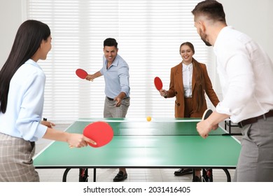 Business People Playing Ping Pong In Office