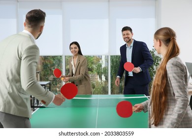 Business People Playing Ping Pong In Office