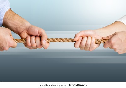 Business People Pulling The Rope In Opposite Directions