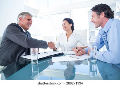 Business People Reaching An Agreement In An Office