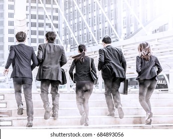 Business People Running In City