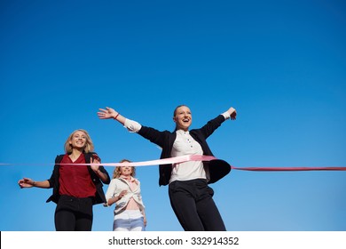 Business People Running Together On  Athletics Racing Track