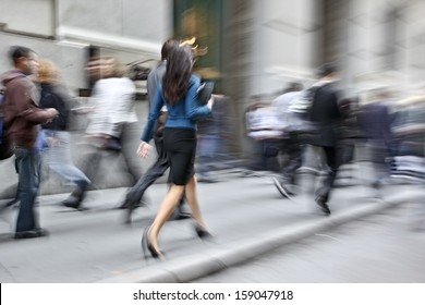 Business People At Rush Hour Walking In The Street, In The Style Of Motion Blur