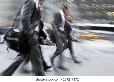 Business People At Rush Hour Walking In The Street, In The Style Of Motion Blur