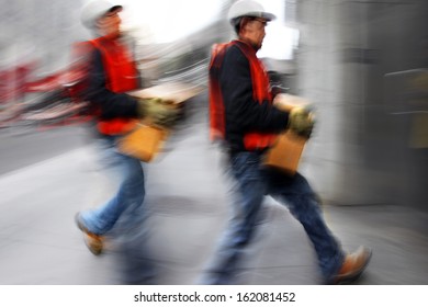 Business People At Rush Hour Walking In The Street, In The Style Of Motion Blur