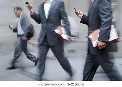 Business People At Rush Hour Walking In The Street, In The Style Of Motion Blur