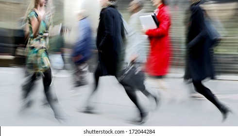 Business People At Rush Hour Walking In The Street, In The Style Of Motion Blur