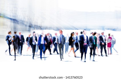 Business people rushing in the City of London against on the skyscrapers. Beautiful abstract blurred image representing modern business life, success, moving concept.