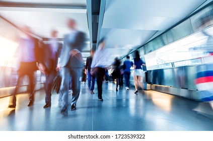 Business people rushing in the lobby.