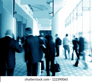 Business People Rushing In The Lobby. Motion Blur