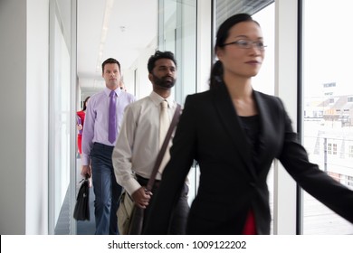 Business People Rushing Past Camera