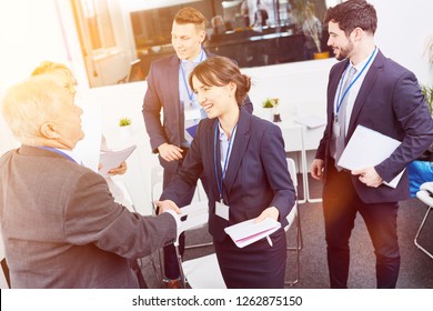 Business People Shake Hands After Workshop As Thank You Sign