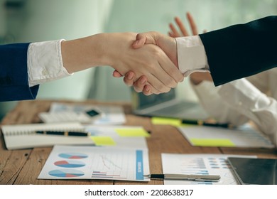 business people shake hands to make an agreement during a board meeting in the office Teamwork, agreement, cooperation, real estate business concept. - Shutterstock ID 2208638317