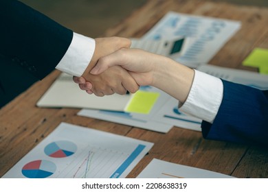 business people shake hands to make an agreement during a board meeting in the office Teamwork, agreement, cooperation, real estate business concept. - Shutterstock ID 2208638319