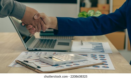 business people shake hands to make an agreement during a board meeting in the office Teamwork, agreement, cooperation, real estate business concept. - Shutterstock ID 2208638325