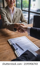 Business people shaking hand after business signing contract and resume on desk in meeting room at company office, job interview, investor, negotiation, partnership and teamwork Partnership concept - Shutterstock ID 2195906743