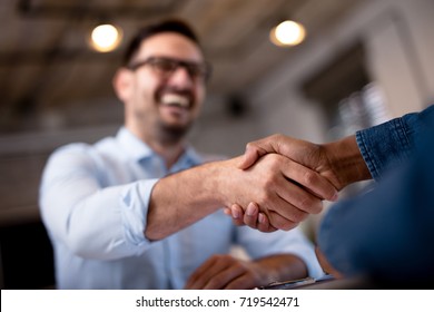 Business people shaking hands. - Shutterstock ID 719542471