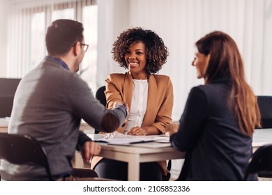 Business people shaking hands after meeting - Shutterstock ID 2105852336