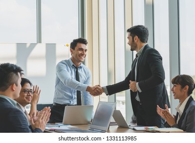 Business people shaking hands congratulations to work success - Shutterstock ID 1331113985