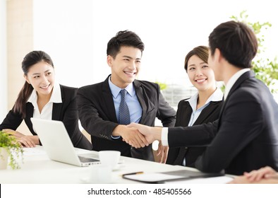 business people shaking hands during meeting