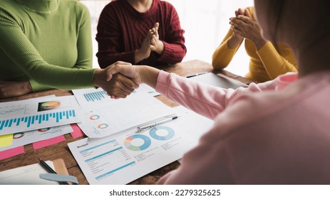 Business people shaking hands, finishing up meeting, business etiquette, congratulation, merger and acquisition concept - Powered by Shutterstock