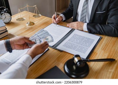 Business People Shaking Hands And Give An Under-the-table Bribe To An Attorney To Help A Lawyer Win A Court Case. Bribery And Kickback Ideas Fraud And Fraud