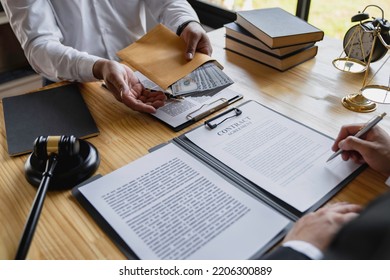 Business People Shaking Hands And Give An Under-the-table Bribe To An Attorney To Help A Lawyer Win A Court Case. Bribery And Kickback Ideas Fraud And Fraud